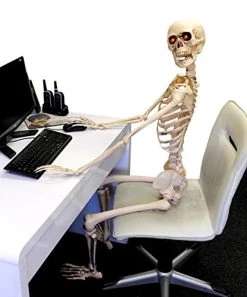 ILOVEFANCYDRESS HUGE 5FT LIFE-SIZED POSABLE SKELETON WITH GLOWING RED EYES HALLOWEEN PROP / DECORATION. LIFESIZE HUMAN SKELETON PROP WITH GLOWING RED EYES. PERFECT DECORATION FOR HALLOWEEN EVENTS